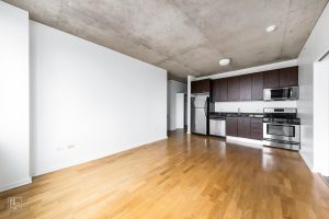 Kitchen and living room before custom virtual staging.