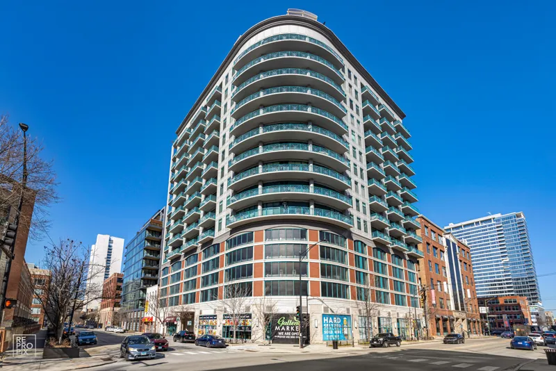 Downtown Chicago condominium tower with curved glass balconies — listing photography